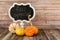 Chalkboard sign and decorative fall gourds