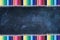 Chalkboard Texture Background with Rows of Colored Pencils