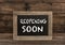 Chalkboard wooden background Reopening soon