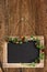 Chalkboard on wooden wall with christmas tree bruch