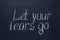 Chalkboard writing Let go of your fears. Motivational and encouraging lettering