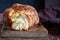 Challah or Hala is a traditional jewish sweet fresh sabbath bread loaf, fresh bun on cutting board. Brioche bread on breakfast