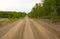 A challenging road leading to a remote destination in northern Canada