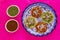 Chalupas poblanas, mexican food Puebla Mexico on a pink background