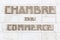 Chamber of commerce sign in French on a wall