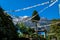 Chame - Prayer flags waving above Himalayan peaks