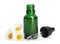 Chamomile flowers and cosmetic bottle of essential oil