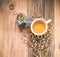 Chamomile tea with dried petals on wooden table