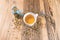 Chamomile tea with dried petals on wooden table