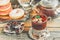 Chamomile tea in a glass glass with chocolate and doughnuts in icing