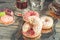 Chamomile tea in a glass glass with chocolate and doughnuts in icing