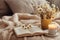 A chamomile-themed flat lay arrangement with chamomile tea, fresh flowers, a book, and a cozy blanket, creating a cozy and