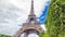 Champ de Mars and the Eiffel Tower timelapse hyperlapse in a sunny summer day. Paris, France