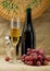 Champagne bottle, bucket, goblet and grapes