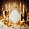 Champagne bottle, candles, golden glasses, blank card and a nice setup with golden decor
