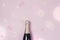 Champagne Bottle on Pink Background Minimal Party Holiday Concept Festive Top View Drawing Lights