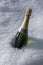 Champagne bottle in snow