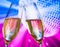 Champagne flutes with golden bubbles make cheers on sparkling blue and violet disco ball background