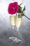 Champagne Flutes and a Pink Rose on Gray Tulle Background #1