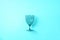 Champagne glass on blue background with copy space for text. Top view. Holiday and celebration concept