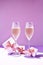 Champagne glass with gift boxes on color defocused background, copy space for text, party celebration