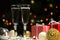 Champagne glasses and Christmas balls and Christmas gifts