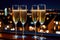 Champagne glasses flutes on balcony overlooking city, festive special occasion