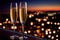 Champagne glasses flutes on balcony overlooking city, festive special occasion