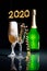 Champagne glasses and green champagne bottle lighted with grid and sidelight.