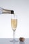 Champagne pouring into an elegant glass