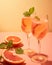 Champagne, rose sparkling wine or paloma cocktails in crystal glasses