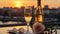 Champagne and rose. Two glasses of champagne on rooftop and cityscape view with twilight sunset time. Generative AI