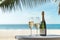 Champagne wine glasses and bottle on table top with a good view of blue sea at beach. Summer tropical vacation concept.