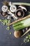 Champignons, leek, parsnip, garlic and fennel on grey background. Top view photo of fresh seasonal vegetables. Healthy menu ideas.