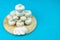 Champignons on a round wooden Board on a blue background