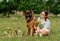 Champion German Shepherd on grass with golden medals