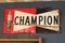 Champion spark plugs logo brand and text sign on old rusty panel racing vintage car