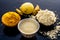 Chana,haldi,limbo ka ubtan or ayurvedic face pack of Turmeric, Lemon, and gram flour on wooden surface for good skin and no acnes