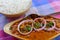 Chana masala, close up, selective focus. National Indian dish, chickpeas in hot masala sauce with various spices and boiled rice