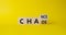 Chance vs Chaos symbol. Turned wooden cubes with words Chaos and Chance. Beautiful yellow background. Psychology and Chance vs