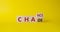 Chance vs Chaos symbol. Turned wooden cubes with words Chaos and Chance. Beautiful yellow background. Psychology and Chance vs