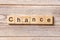 CHANCE word written on wood block. CHANCE text on table, concept