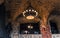 Chandelier hanging in old castle cellar