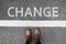 Change business and changing ahead concept background. Selfie of feet and legs in leather ankle boots shoes on pathway. Moving