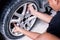 Change a flat car tire at car park with Tire maintenance, damaged car tyre