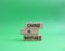 Change is Inevitable symbol. Wooden blocks with words Change is Inevitable. Beautiful green background. Business and Change is