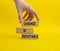 Change is Inevitable symbol. Wooden blocks with words Change is Inevitable. Beautiful yellow background. Businessman hand.