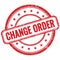 CHANGE ORDER text on red grungy round rubber stamp
