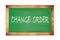 CHANGE  ORDER text written on green school board