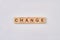 Change written with wooden blocks.